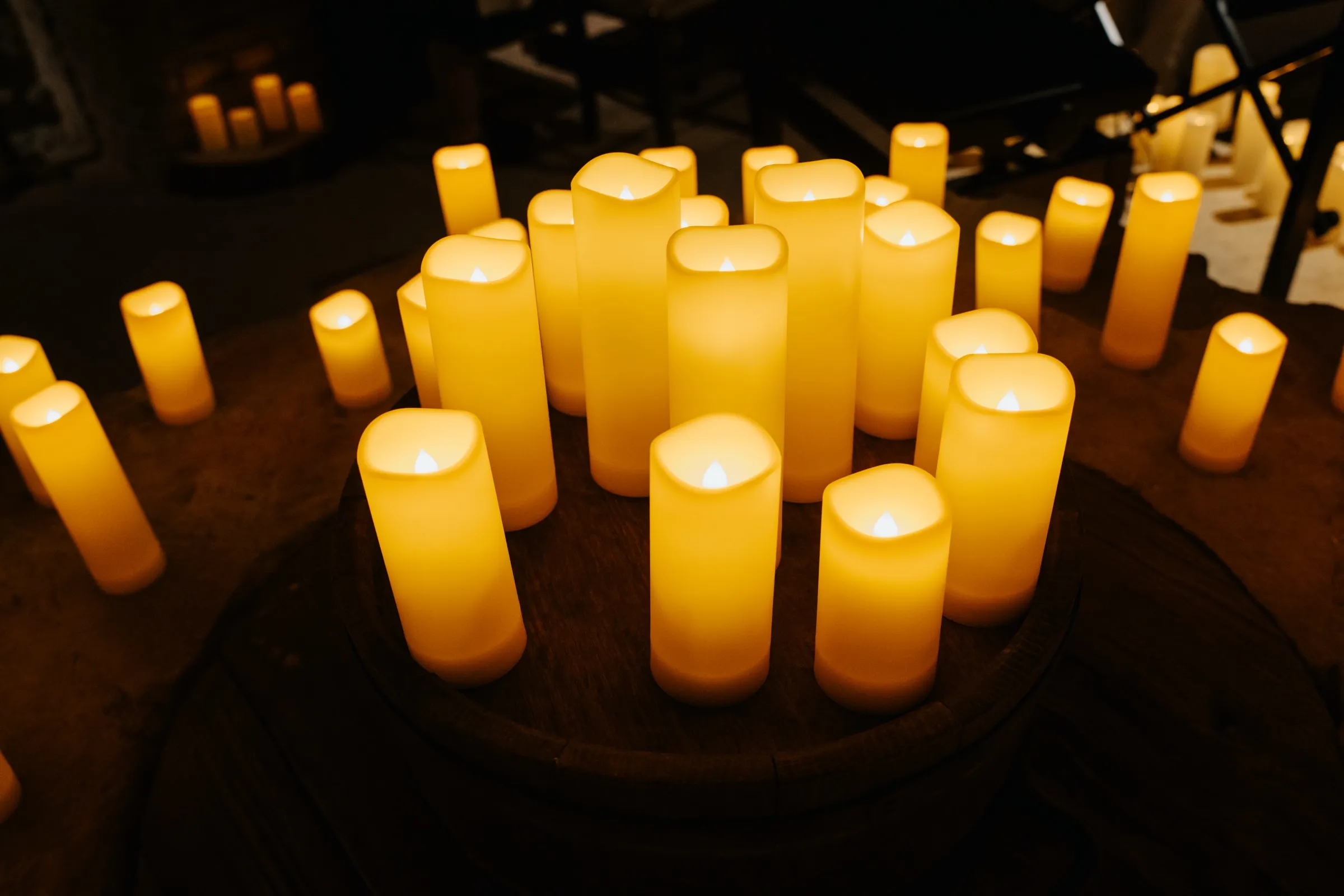 Cluster of candles in a concert setting