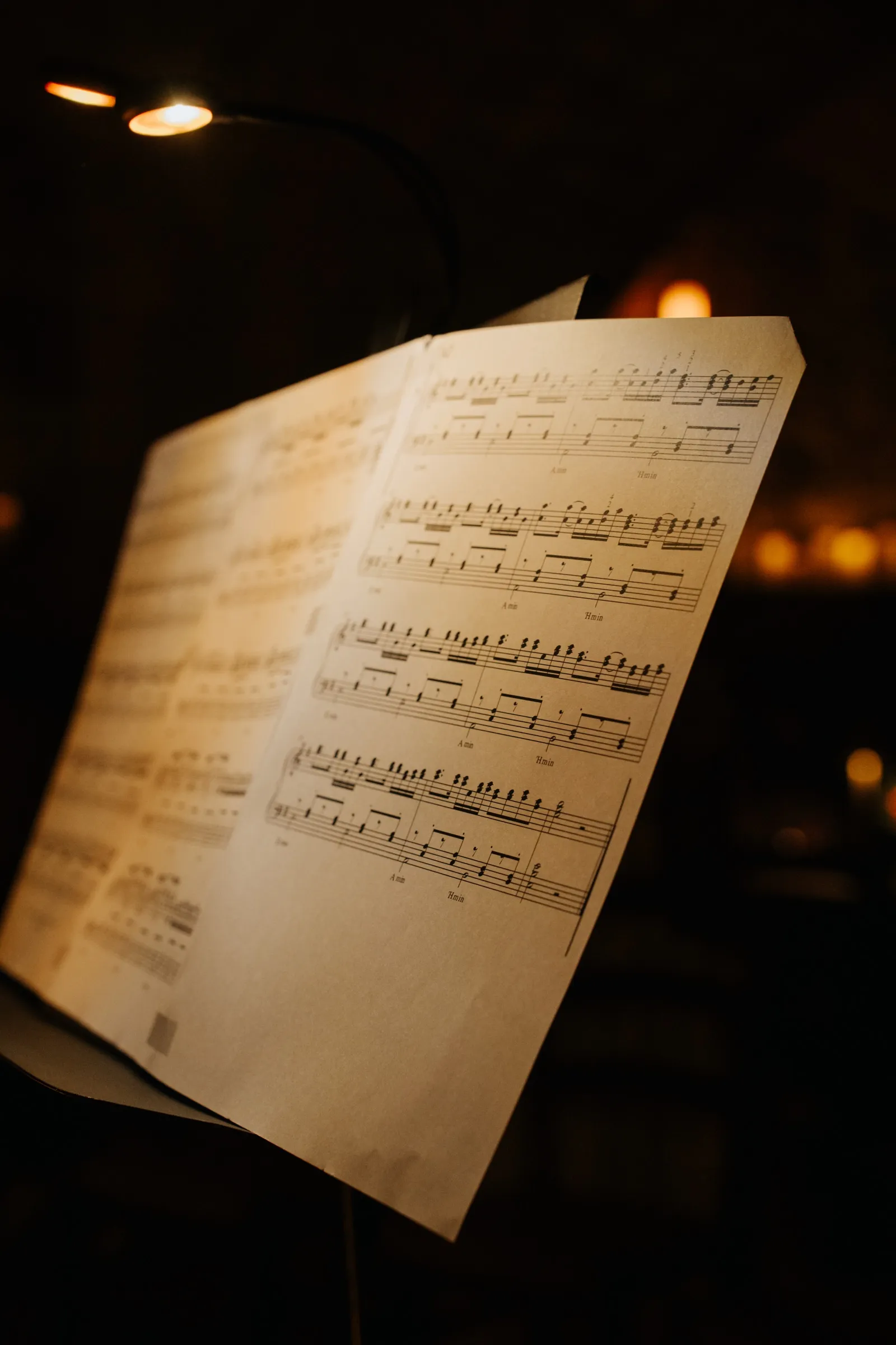 Open sheet music by candlelight