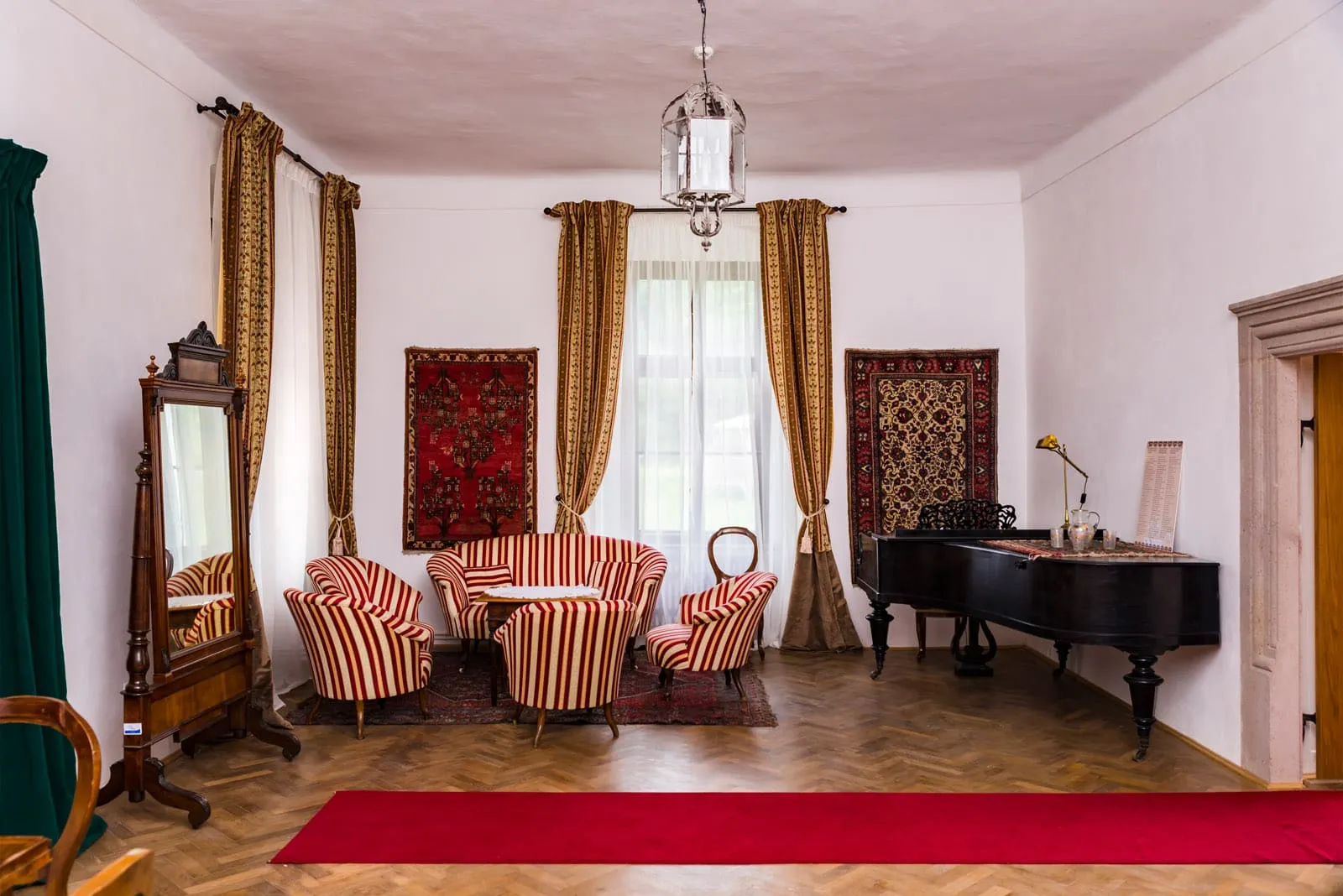 Furniture, textiles and everyday objects on display in a museum room of the castle