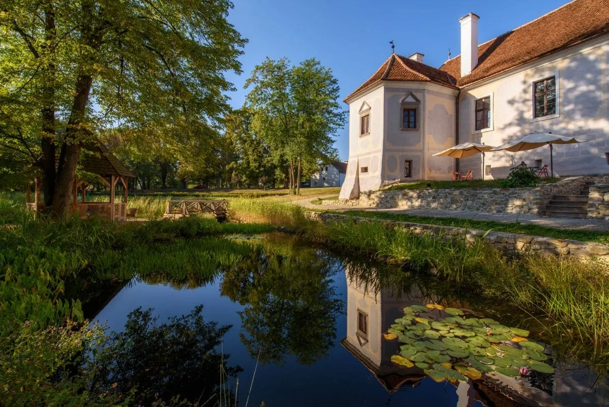 Pond and wooden gazebo at Miklósvár Castle
