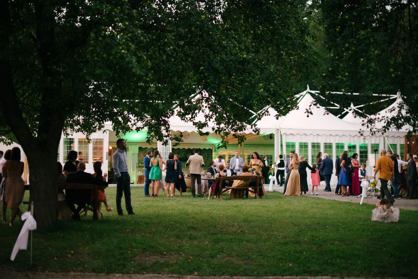 Wedding guests in the garden at Miklósvár Castle