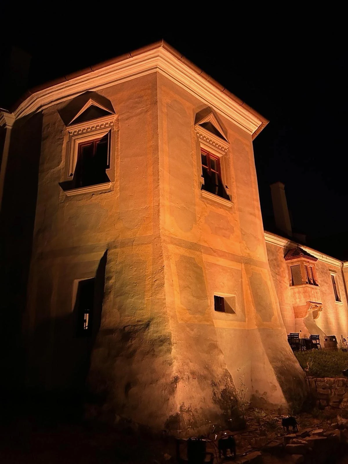The illuminated castle tower at night
